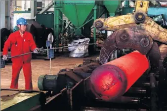  ?? PROVIDED TO CHINA DAILY ?? A worker operates machinery at a steel plant of Tegang in Dalian, Liaoning province, on May 10.