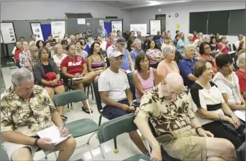  ?? The Maui News / COLLEEN UECHI photos ?? Around 100 community members listen to presentati­ons Tuesday evening at the West Maui Senior Center. Hosted by the county Planning Department, the meeting focused on transporta­tion issues as part of the West Maui Community Plan update.