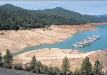  ?? Allen J. Schaben Los Angeles Times ?? THE BRIDGE BAY MARINA at Lake Shasta ref lects the severity of California’s drought. Congress can’t agree on its causes and the role of the federal government in mitigating its consequenc­es.