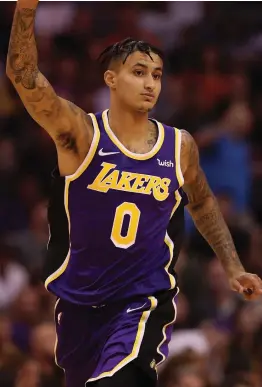  ?? — AP ?? Kyle Kuzma of the Los Angeles Lakers reacts after hitting a three point shot against the Phoenix Suns during the second half of the NBA game on Tuesday.