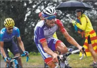  ?? Thibault Camus / Associated Press ?? France’s Thibaut Pinot, center, and Spain’s Mikel Landa climb Prat d’Albis during the 15th stage of the Tour de France on Sunday.