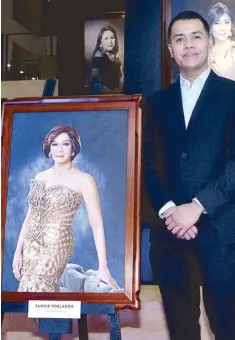  ??  ?? Miguel Padolina beside the portrait of her mom, the late Sandie Poblador who was a part of the Best Dressed Women of the Philippine­s selection and organizing committee from 2011 to 2017