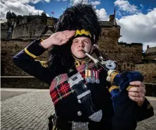  ??  ?? Pipe Major Ben J Duncan, from the Royal Scots Dragoon Guards Pipes & Drums, previews the Heroes of St Valery from the doorstep of Edinburgh Castle