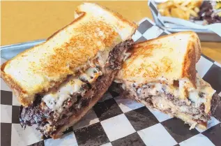  ?? ?? Stackers’ Patty Melt, two beef patties with American cheese and Stackers sauce, a kind of spicy aioli, served on Texas toast.