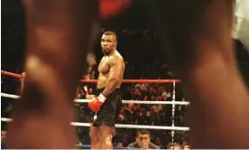  ?? Photograph: Al Bello/AllSport ?? ‘Every fighter that’s beaten him, he couldn’t intimidate. Every one who he’s beaten, he could intimidate. If he can’t intimidate you, that’s a killer for him’ … Mike Tyson in 1996.