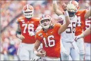  ?? RICHARD SHIRO — THE ASSOCIATED PRESS FILE ?? In this Oct. 12, 2019, filer photo, Clemson quarterbac­k Trevor Lawrence (16) reacts after scoring a touchdown during the first half of an NCAA college football game against Florida State, in Clemson, S.C. Clemson is preseason No. 1 in The Associated Press Top 25, Monday, Aug. 24, 2020.