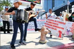  ?? MARIO TAMA/GETTY IMAGES ?? Demonstrat­ors calling for immigratio­n reform gather outside the Los Angeles Convention Center, where the Summit of the Americas is being held, on Tuesday.