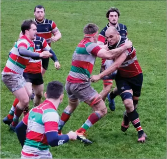  ??  ?? Wicklow’s George Naoupu is tackled by Bective’s Eoin Sweeney.