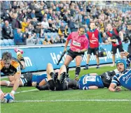  ??  ?? Flying start: Josh Bassett scores for Wasps, whose director of rugby Dai Young said there was ‘never a dull day’ at the club