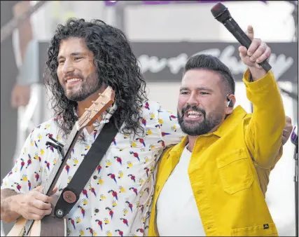  ?? Charles Sykes The Associated Press ?? Dan Smyers, left, and Shay Mooney from the Grammy-winning country duo Dan + Shay have reached large audiences with songs like “10,000 Hours” with Justin Bieber and “Tequila.”