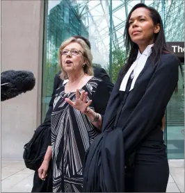  ?? Canadian Press photo ?? Green Party Leader Elizabeth May, left, speaks to reporters as one of her lawyers, Andi Mackay, listens outside B.C. Supreme Court in Vancouver, on Monday after pleading guilty to a criminal contempt of court charge for violating an injunction at a...