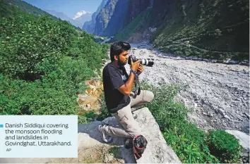  ?? AP ?? Danish Siddiqui covering the monsoon flooding and landslides in Govindghat, Uttarakhan­d.