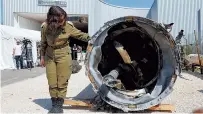  ?? Reuters-Yonhap ?? Israel’s military displays what they say is an Iranian ballistic missile retrieved from the Dead Sea, at Julis military base in southern Israel, Tuesday.