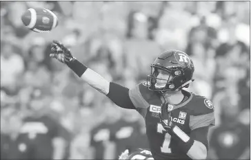  ?? THE CANADIAN PRESS/SEAN KILPATRICK ?? Ottawa Redblacks quarterbac­k Trevor Harris (7) makes a pass during first half CFL football action against the Montreal Alouettes in Ottawa on Wednesday, July 19, 2017.