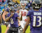 ?? KARL MERTON FERRON / BALTIMORE SUN ?? QB Lamar Jackson has led the Ravens back into the AFC playoff race by winning four of his five starts. He’s run for 427 yards in those games.
