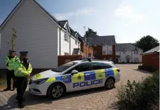  ??  ?? Police guard the entrance to the housing estate in Amesbury where Charles Rowley and Dawn Sturgess were found