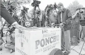  ?? Antonio Perez / Chicago Tribune ?? A grateful Fidencio Sanchez pushes his paletas cart one last time in Chicago last month before a group of media after accepting a check for $384,290 during a news conference outside an ice cream shop where he rented his paletas cart.