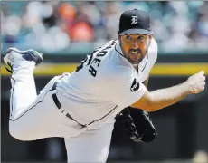  ?? Carlos Osorio The Associated Press ?? Tigers pitcher Justin Verlander delivers in the fifth inning of Detroit’s 6-1 win over the Dodgers on Sunday at Comerica Park. He held Los Angeles to one run on two hits and one walk and struck out nine in eight innings.