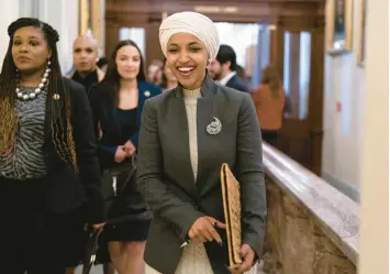  ?? JOSE LUIS MAGANA/AP ?? Rep. Ilhan Omar leaves the House chamber Thursday after being voted off the Foreign Affairs panel.