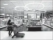  ?? ERIC GAY/AP ?? A shopper walks through the cosmetic department at a Target store in San Antonio, Texas.