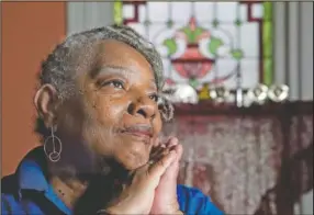  ??  ?? Laurette McNear talks about her younger adopted sister, Cheryl Edwards, in her West Philadelph­ia home.