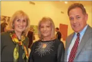  ??  ?? Kathy O’Keefe (left) and her husband, Brian, chat with Nan Mangine of Wayne.