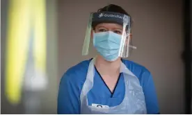  ??  ?? A healthcare worker wearing PPE during the coronaviru­s testing of NHS staff. Photograph: Murdo MacLeod/The Guardian