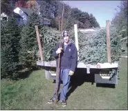  ?? COURTESY OF STEVEN CUSTER ?? R.T.Custer working with his father, Steven Custer, in 2007 at Delong Christmas Tree Farm in Brecknock Township. R.T. Custer was a junior at Gov. Mifflin High School at the time. He is picking up trees Longwood Gardens – who were picking up their trees the next day.The farm was sold at auction Dec. 28, 2020.