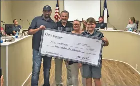  ?? HERALD photo/Shawn Moran ?? Jayden Torres was presented with a scholarshi­p from Gexa Energy during Thursday evening’s school board meeting.