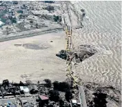  ?? ?? Damage to roads and bridges means rescuers are finding it difficult to access the worst-hit areas, but they did manage to evacuate a survivor from a damaged house in Palu, right. Below, looters target a convenienc­e store taking noodles and cooking oil