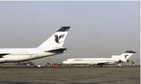  ?? Vahid Salemi / Associated Press 2008 ?? Two passenger planes of Iran Air sit at the Mehrabad Airport in Tehran. Most Iranian planes were purchased before the 1979 Islamic Revolution.