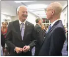  ?? ?? Gov. Asa Hutchinson with fellow honoree Walter E. Hussman Jr.