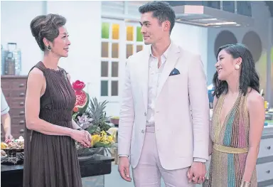  ??  ?? Michelle Yeoh, Henry Golding and Constance Wu in Crazy Rich Asians. Left, J-Lo.