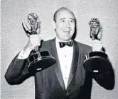  ?? AP 1963 ?? Carl Reiner holds two Emmys presented to him as best comedy writer for “The Dick Van Dyke Show.”