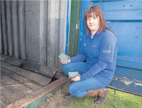  ??  ?? Staff member Emma Christie at the container where the quad bikes were stored.