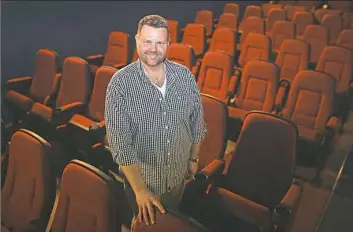  ?? Nate Guidry/Post-Gazette ?? Richard Fosbrink, executive director of the Theatre Historical Society of America, stands inside the Hollywood Theater in Dormont. The society just completed its purchase of the movie house, which was built in 1925.