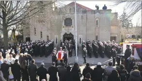  ?? Bebeto Matthews / Associated Press ?? Fallen firefighte­r Steven Pollard’s casket is carried out of Good Shepherd Roman Catholic Church on Friday in the Brooklyn borough of New York.