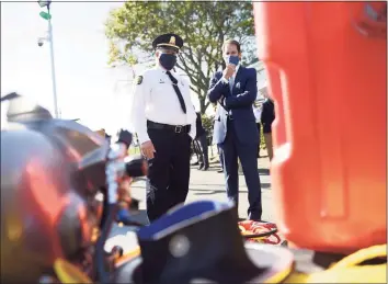  ?? Tyler Sizemore / Hearst Connecticu­t Media ?? Police Capt. James Bonney, left, shows U.S. Rep. Jim Himes, D-Conn., new marine equipment at the Greenwich Police Marine Division dock.