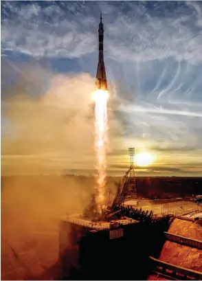  ?? KIRILL KUDRYAVTSE­V / AFP / GETTY IMAGES ?? A Soyuz MS-11 rocket carrying Russian, American and Canadian astronauts takes off from the Baikonur Cosmodrome in Kazakhstan on Monday.