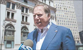  ?? KEVIN HAGEN/AP ?? Geoffrey Berman speaks with reporters Saturday. Berman agreed to step down as U.S. attorney for the Southern District of New York after saying he would stay on the job.