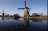  ?? AP FILE PHOTO ?? Windmills line Hooge Boezem van de Overwaard canal at the Unesco World Heritage site in Kinderdijk, Netherland­s.