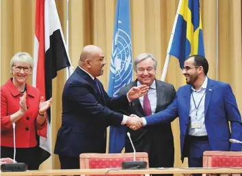  ?? Reuters ?? Yemeni Foreign Minister Khaled Al Yamani shakes hands with the head of the Al Houthi delegation Mohammad Abdul Salam (right) next to Guterres and Swedish Foreign Minister Margot Wallstrom (left), at the Johannesbe­rg castle in Rimbo, near Stockholm yesterday.