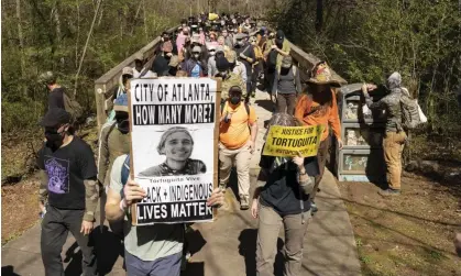  ?? Photograph: Steve Eberhardt/Zuma Press Wire/Rex/ Shuttersto­ck ?? Hundreds of people march to protest ‘Cop City’ in Atlanta, Georgia, on Saturday.