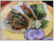  ?? (Arkansas Democrat-Gazette/Eric E. Harrison) ?? El Sur puts its tacos — filled with birria (from left), pollo asada and carne asada — into made-to-order corn tortilla shells.