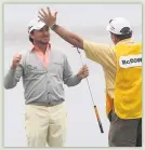  ??  ?? McDowell celebrates with his caddie after winning the 2010 US Open