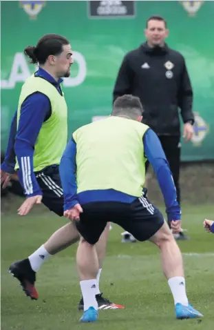  ?? WILLIAM CHERRY/ PRESSEYE ?? Watching brief: Ian Baraclough looks on with George Saville in the thick of things at yesterday’s training session