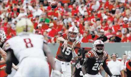  ?? Gerry Broome ?? North Carolina State’s Ryan Finley (15) has an NFL arm and a chance to make noise against heavily favored Clemson. The Associated Press