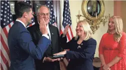  ?? Speaker Paul Ryan, left, holds a ceremonial swearing-in for Rep.-elect Debbie Lesko, second from right, accompanie­d by her family. MANUEL BALCE CENETA/AP ??