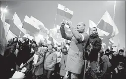  ?? SEAN GALLUP/GETTY ?? More than 250,000 people participat­e in a march on Sunday in Warsaw, Poland.