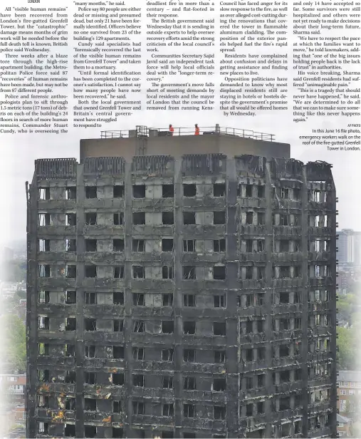  ?? AP PHOTO ?? In this June 16 file photo, emergency workers walk on the roof of the fire-gutted Grenfell Tower in London.